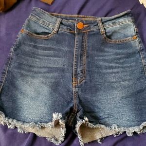 Distressed blue jeans shorts